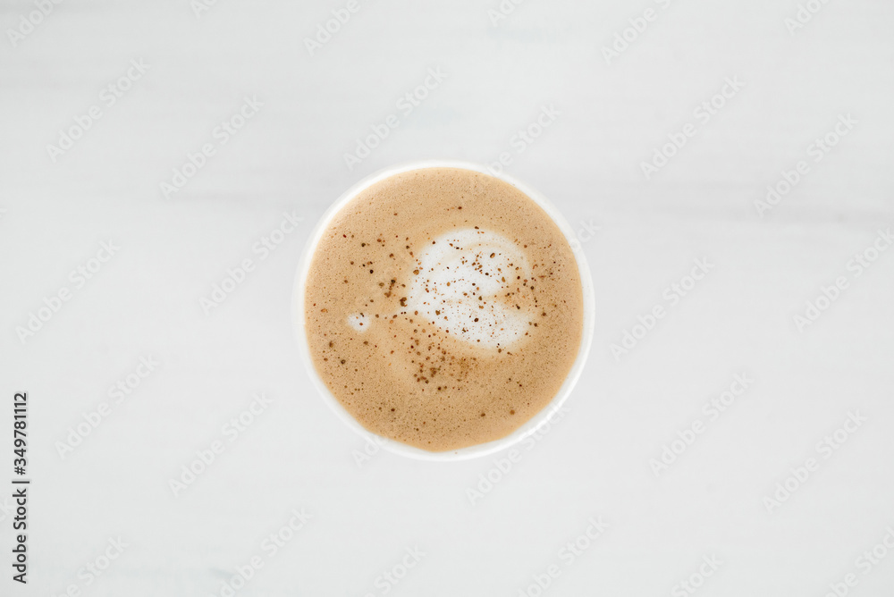 cappuccino in a white glass on a white table cappuccino in a white glass on a white table