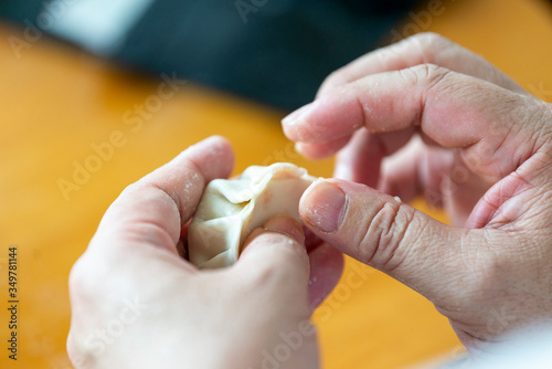 A chef is making dumplings