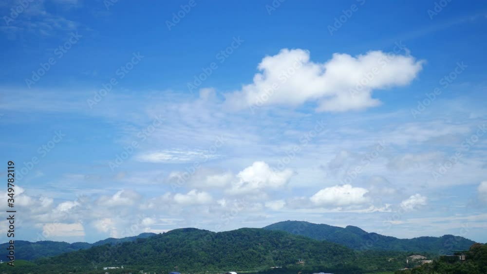 moving white cloud above high mountain with beautiful blue sky background at day time moving white cloud above high mountain with beautiful blue sky background at day time