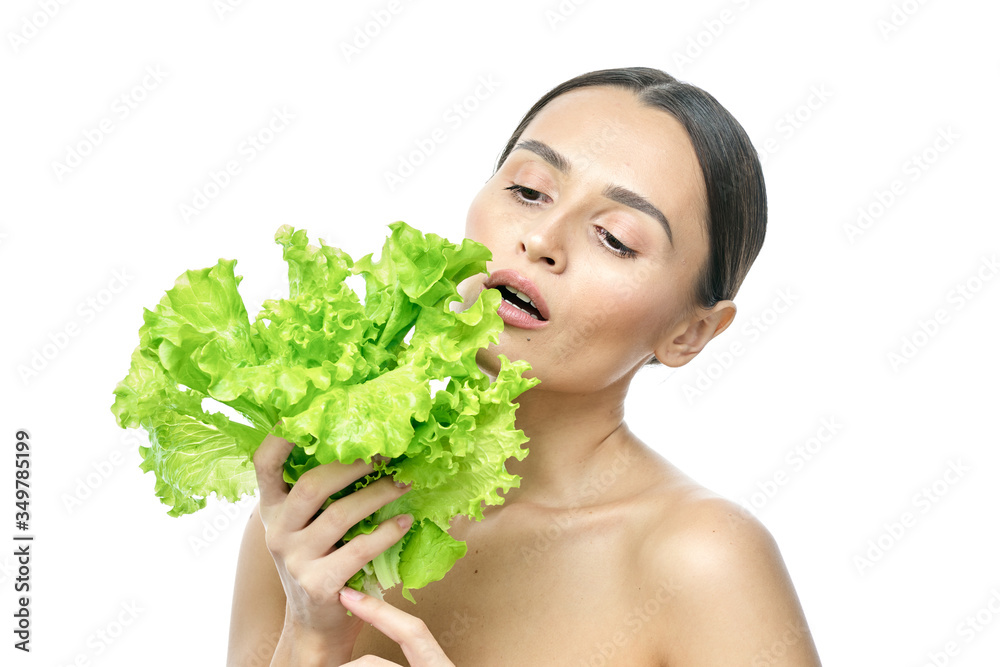 portrait of a girl with clean skin without makeup with a leaf of green salad portrait of a girl with clean skin without makeup with a leaf of green salad