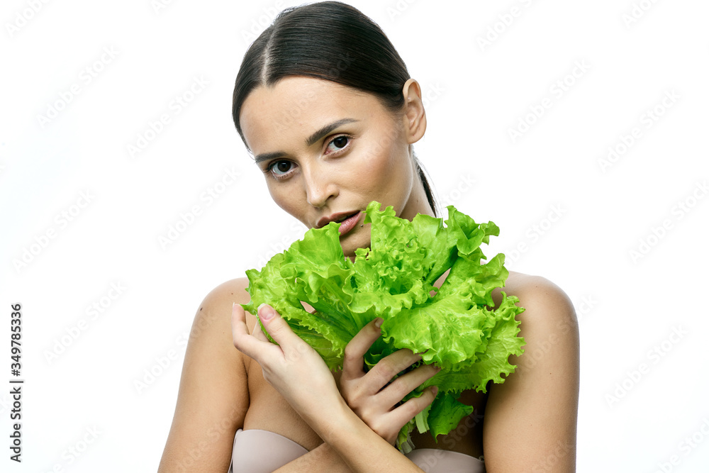 portrait of a girl with clean skin without makeup with a leaf of green salad portrait of a girl with clean skin without makeup with a leaf of green salad