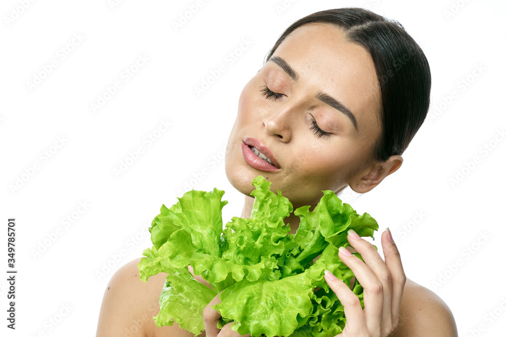 portrait of a girl with clean skin without makeup with a leaf of green salad portrait of a girl with clean skin without makeup with a leaf of green salad