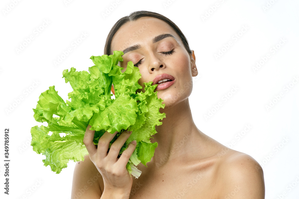 portrait of a girl with clean skin without makeup with a leaf of green salad portrait of a girl with clean skin without makeup with a leaf of green salad