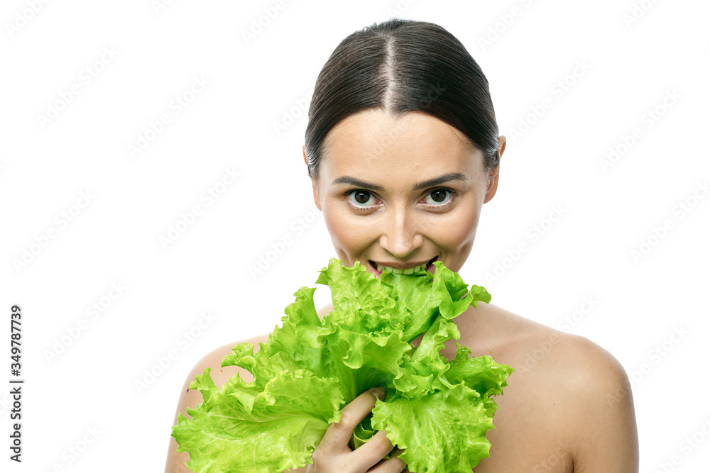 portrait of a girl with clean skin without makeup with a leaf of green salad portrait of a girl with clean skin without makeup with a leaf of green salad