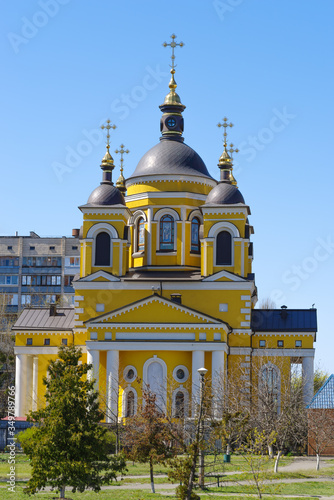 Religious traditions of Ukraine and church holidays. Orthodox church in the Obolonsky district of Kyiv against the blue sky. Orthodox Easter concept. Vertical photo. Kyiv (Kiev), Ukraine, Europe. photo