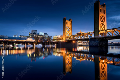 Sacramento Tower Bridge in the twilight with the Ziggurat Building in the background, Riverfront Park, West Sacramento. 