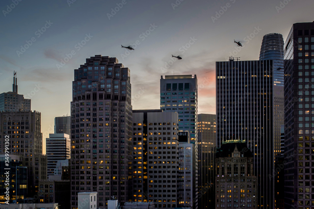 aerial of San Francisco by night with facade of skyscraper