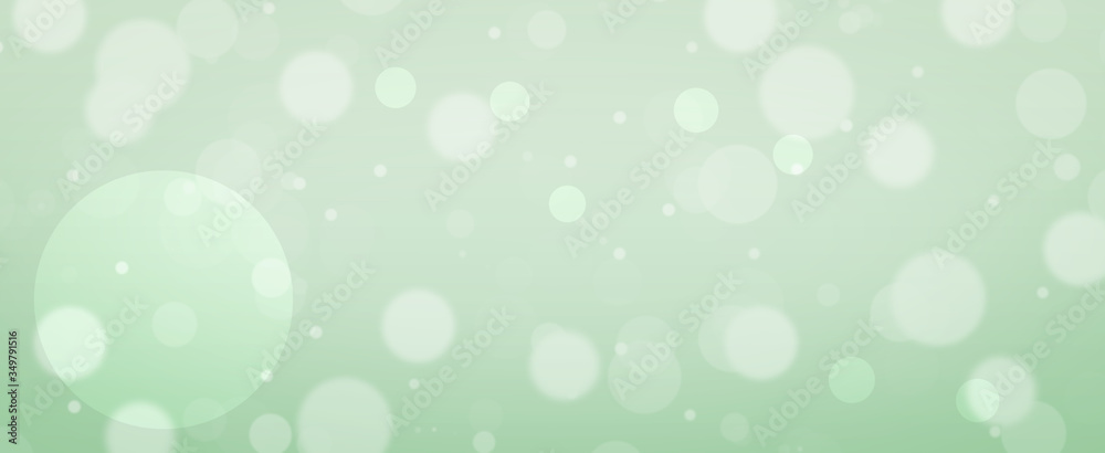 Glowing green circles.  Spring concept.  Blurred bokeh circles.  Website banner.  Celebration.