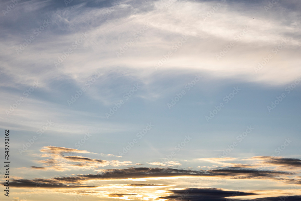 Fototapeta premium beautiful fluffy clouds in the light of morning sun
