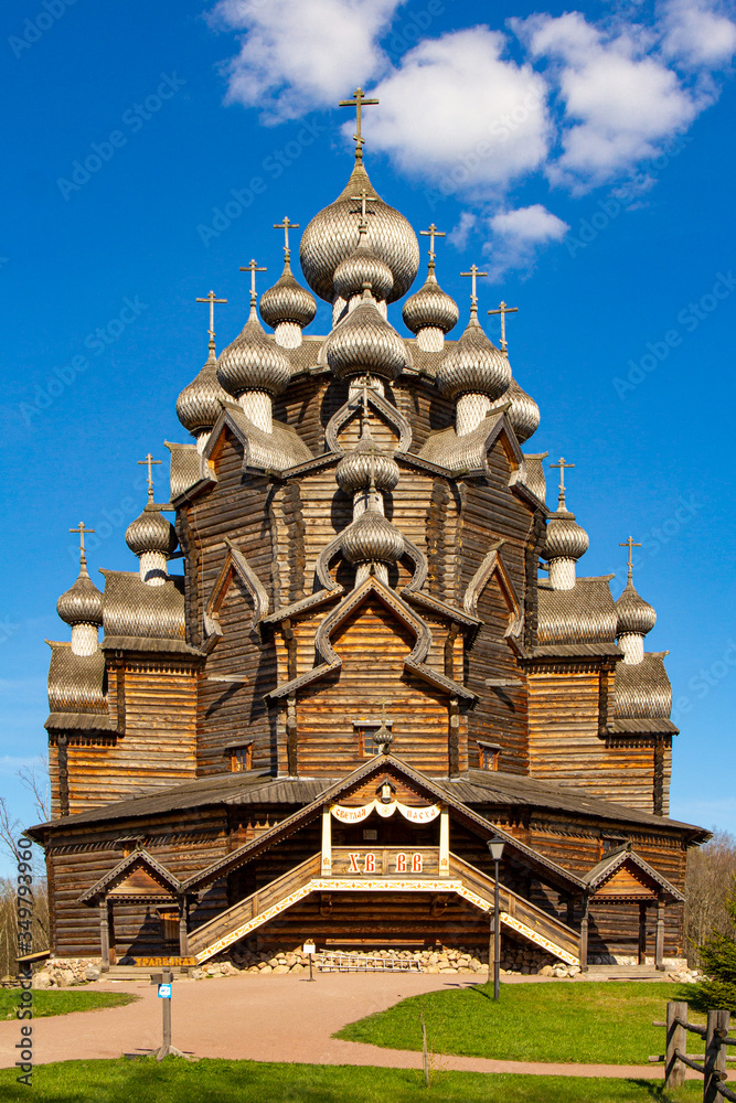 Beautiful Aerial view to traditional Russian village with orthodox wooden chapel and bell tower in Bogoslovka manor. Pokrovskaya multi domed church holy virgin in Easter day. St. Petersburg, Russia. Beautiful Aerial view to traditional Russian village with orthodox wooden chapel and bell tower in Bogoslovka manor. Pokrovskaya multi domed church holy virgin in Easter day. St. Petersburg, Russia.