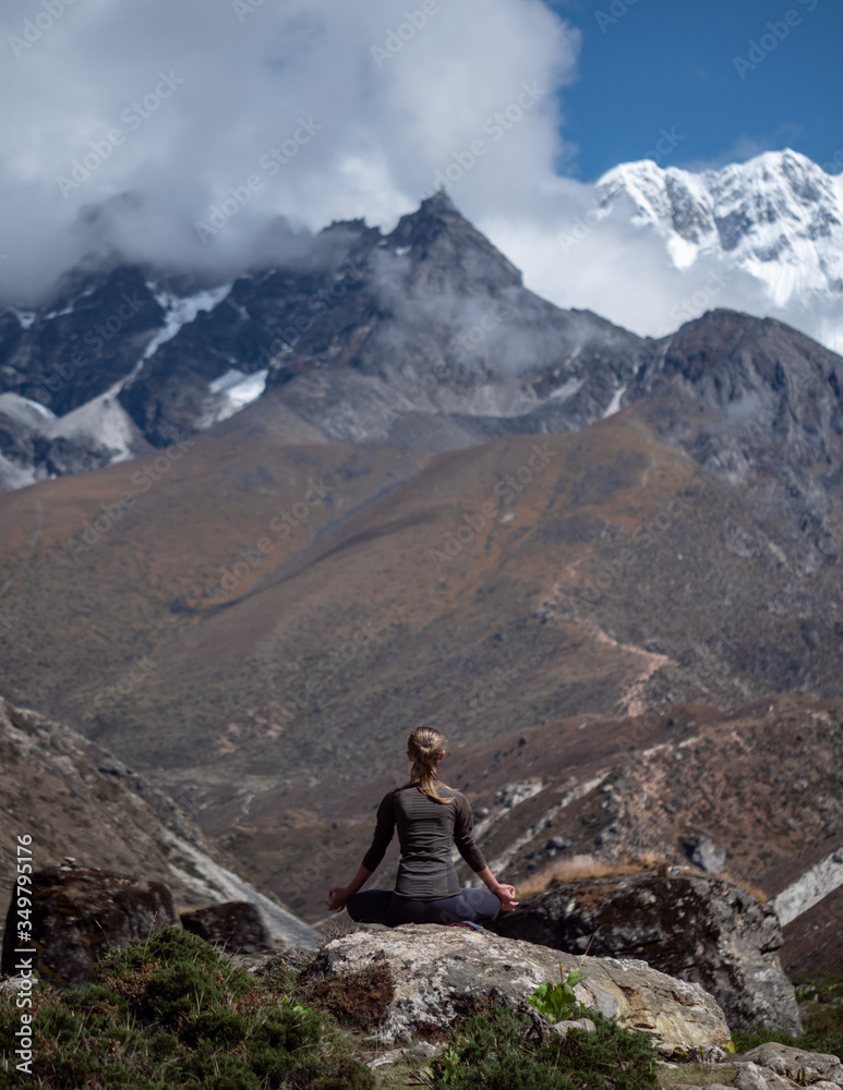 Serenity and yoga practicing at himalayas mountain range, meditation