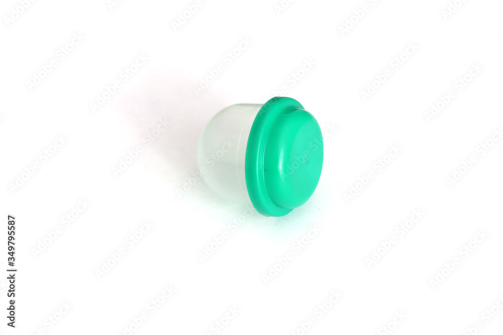 Container. Container Isolate. A container with a green lid. Container for shoe covers. Container. Container Isolate. A container with a green lid. Container for shoe covers.
