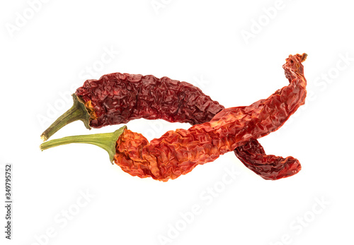 Dried red chili or chilli cayenne pepper isolated on white background cutout photo