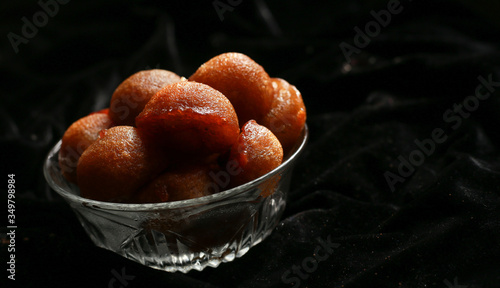 Homemade Kerala sweet snack, delicious Kerala snack unniyappam in dark background