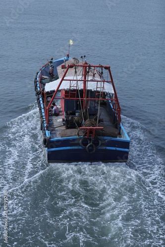 Fishing Boat Arriving To The Harbour