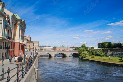 center of the Scandinavian capital of Stockholm with smooth bay water, promenade, yachts and houses. Scandinavian architecture of cities.