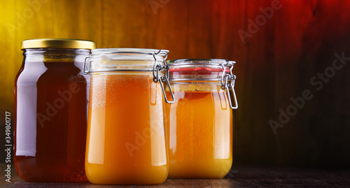 Composition with large jars of honey