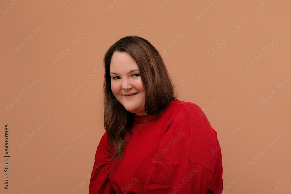 Beautiful young girl in a bright red jacket, overweight girl. Beautiful young girl in a bright red jacket, overweight girl.