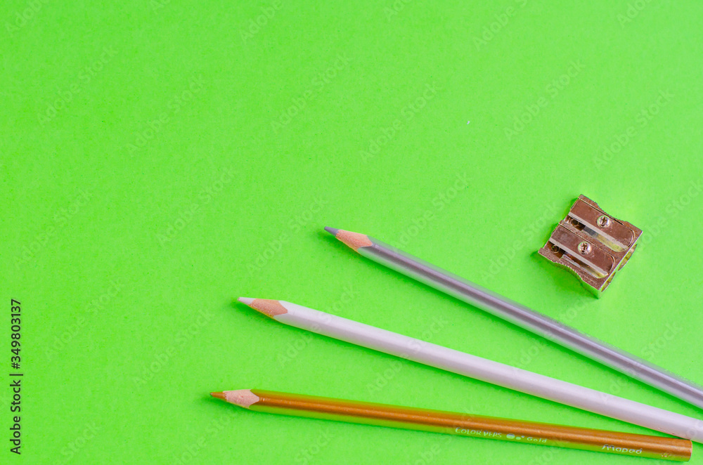 Back to school concept. School and office supplies on office table, green background. Flat lay with copy space. Back to school concept. School and office supplies on office table, green background. Flat lay with copy space.