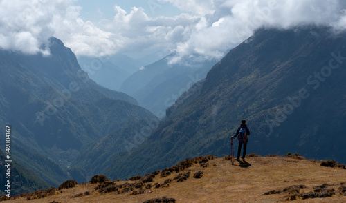 Active hiker in travel to Everest  enjoying the valley view in Himalaya mountains  landscape © Glebstock