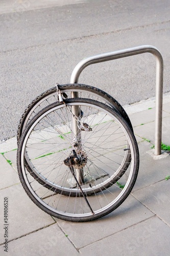 Bike wheels with padlock. Theft of a bicycle. Bicycles stolen and left only wheels. Bicycle theft crimes concept