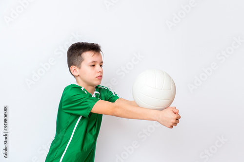Kid play with volleyball over white background. Kid activities.Training game concept.