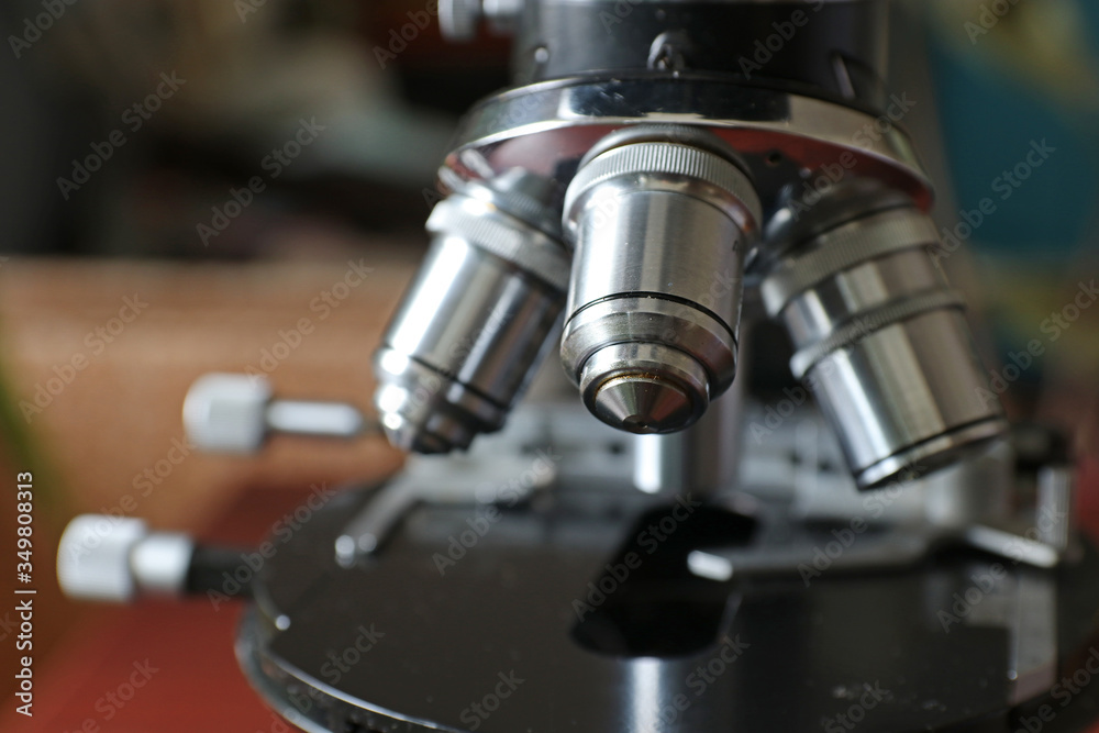 Microscope with metal lenses in a research laboratory. Coronavirus vaccine development.