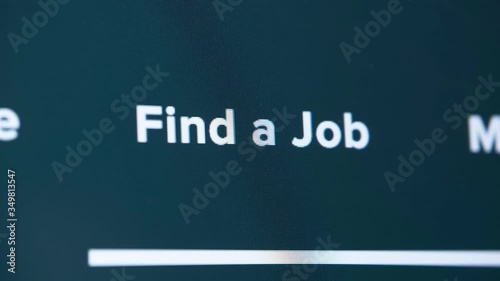 human finger presses or click on screen monitor button - find a job, unemployed try to find new job in crisis situation, online job search in quarantine and isolation, close-up view
