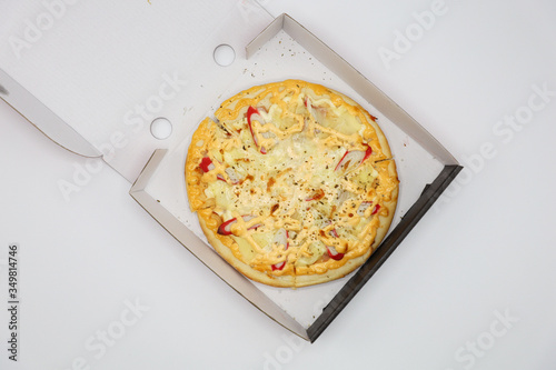 Pizza with chicken and sausage isolated on white background. 