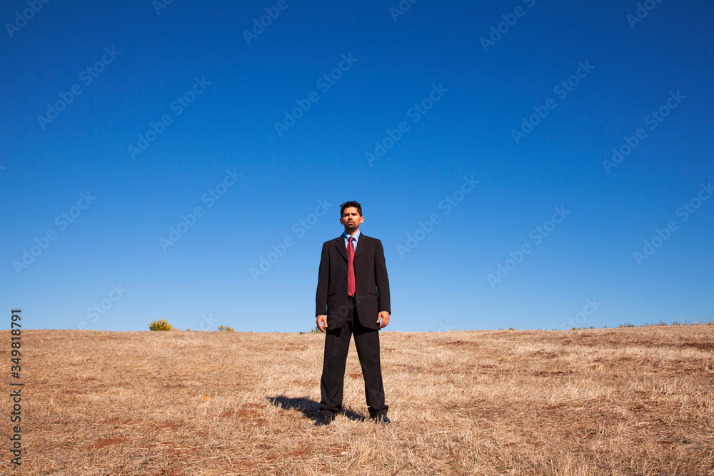 Businessman looking at the field Businessman looking at the field