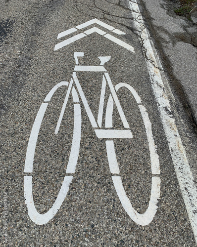 bicycle lane sign on asphalt