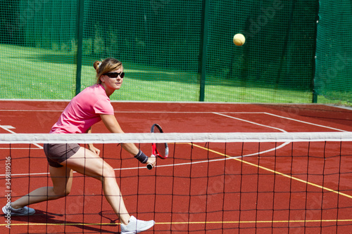 Female tennis player hitting a volley