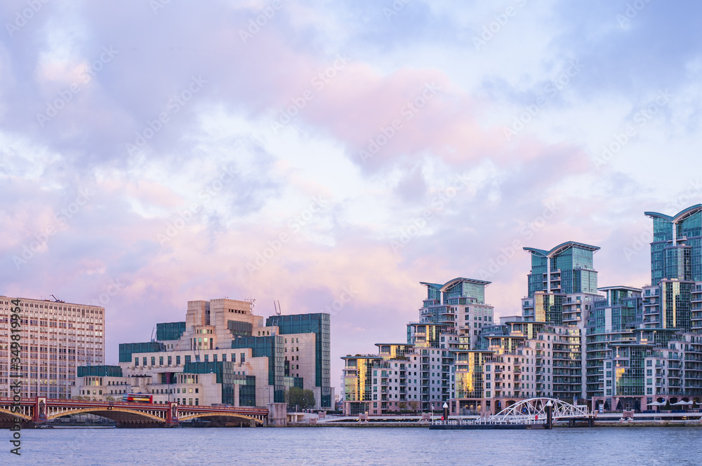 Stunning view of the St George Wharf area illuminated by a beautiful sunset. St George Wharf is a riverside development in Vauxhall, Lambeth, London, England.