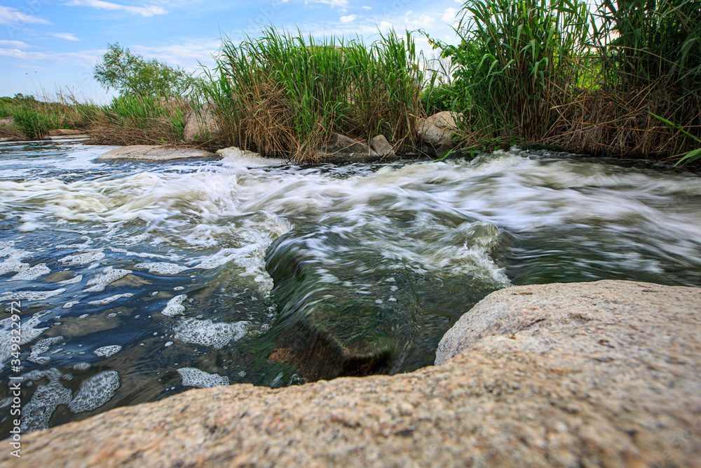 Water stream at cascading waterfall on a long exposure Water stream at cascading waterfall on a long exposure