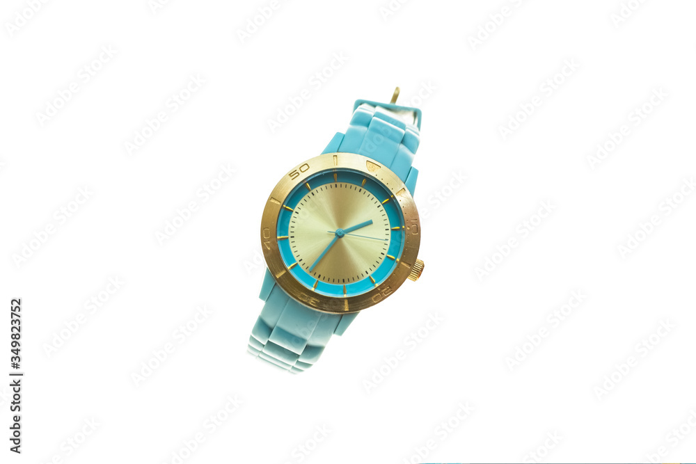 Wristwatch mechanical watch with rubber blue belt with round clock face and gold contour. Stylish, unisex.White isolated background. Wristwatch mechanical watch with rubber blue belt with round clock face and gold contour. Stylish, unisex.White isolated background.