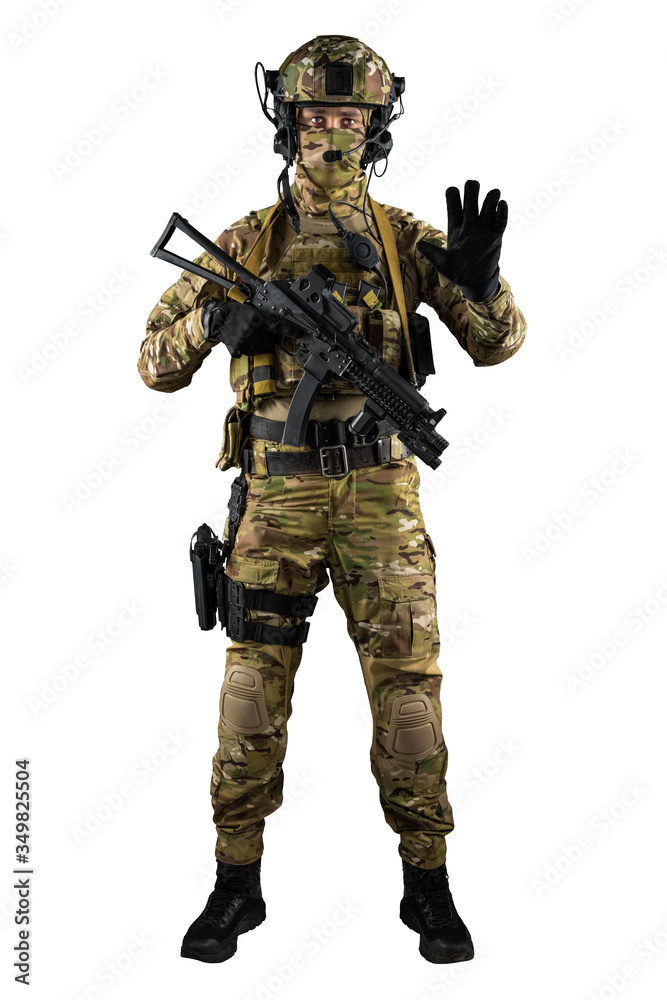 Soldier holding assault rifle. Uniform conforms to special services of the Russian Federation. Shot in studio. Isolated with clipping path on white background Soldier holding assault rifle. Uniform conforms to special services of the Russian Federation. Shot in studio. Isolated with clipping path on white background
