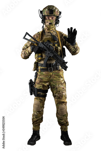 Soldier holding assault rifle. Uniform conforms to special services of the Russian Federation. Shot in studio. Isolated with clipping path on white background