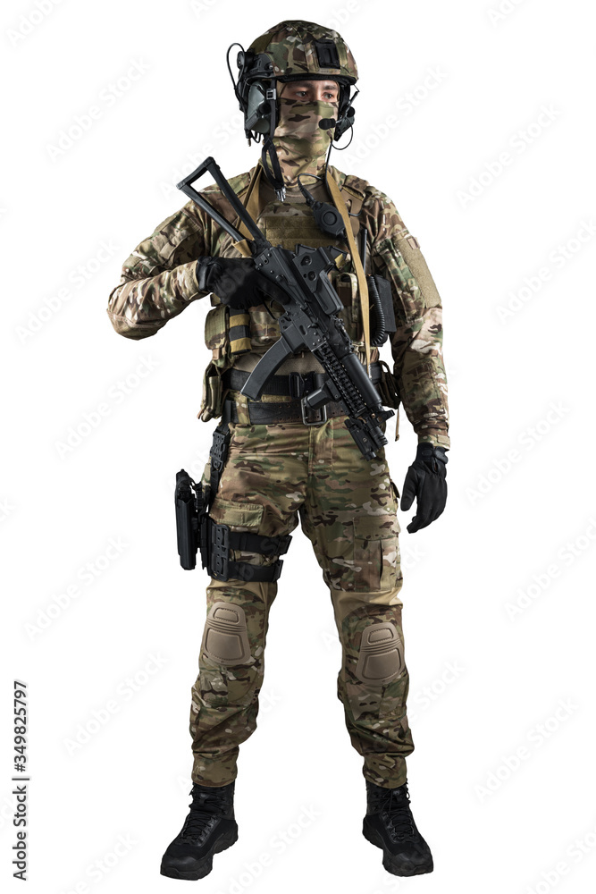 Soldier holding assault rifle. Uniform conforms to special services of the Russian Federation. Shot in studio. Isolated with clipping path on white background Soldier holding assault rifle. Uniform conforms to special services of the Russian Federation. Shot in studio. Isolated with clipping path on white background