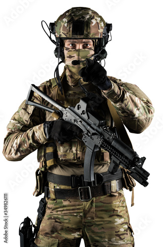 Soldier holding assault rifle. Uniform conforms to special services of the Russian Federation. Shot in studio. Isolated with clipping path on white background