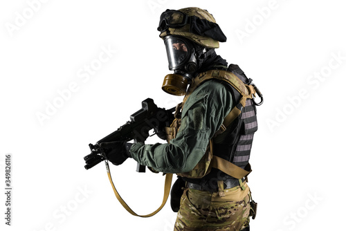 Soldier holding assault rifle. Uniform conforms to special services of the Russian Federation. Shot in studio. Isolated with clipping path on white background