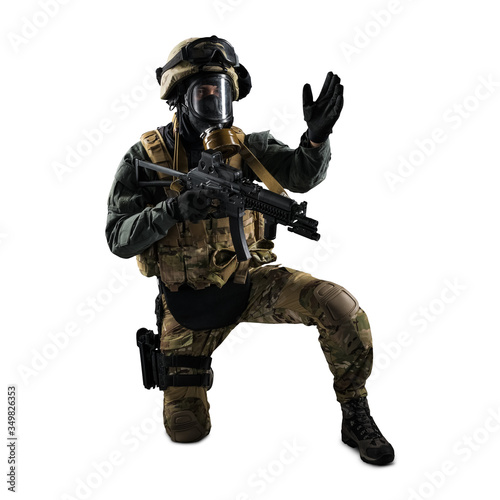 Soldier holding assault rifle. Uniform conforms to special services of the Russian Federation. Shot in studio. Isolated with clipping path on white background © maximapryatin
