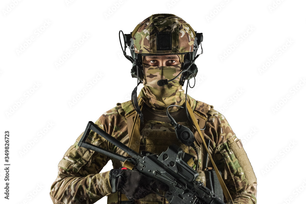 Fototapeta premium Soldier holding assault rifle. Uniform conforms to special services of the Russian Federation. Shot in studio. Isolated with clipping path on white background