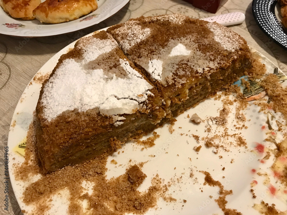 Fototapeta premium Homemade Russian Medovik Cake with Honey, Cinnamon and Powdered Sugar.