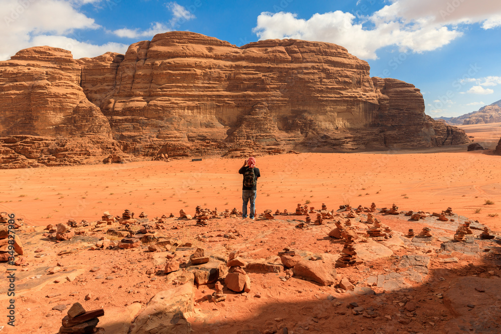 Tourist taking photos in Wadi Rum desert national park, Jordan Tourist taking photos in Wadi Rum desert national park, Jordan