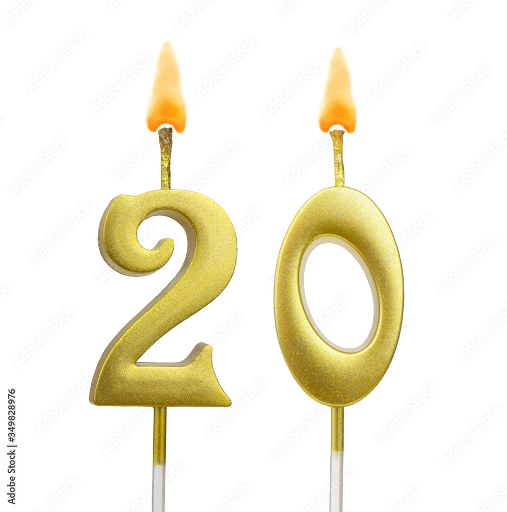 Burning golden birthday candles isolated on white background, number 20 Burning golden birthday candles isolated on white background, number 20