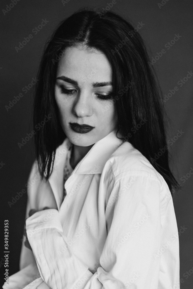 black and white portrait of beautiful young sad brunette girl in white shirt black and white portrait of beautiful young sad brunette girl in white shirt