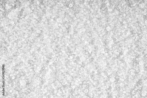 Light background of sprinkled salt at high magnification