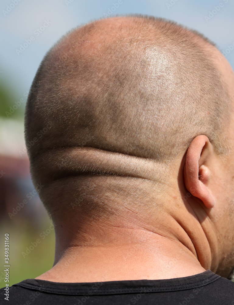 Naklejka premium A short haircut on a man’s head