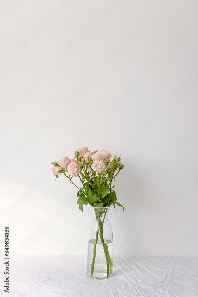 Flowers in a glass vase on the table Flowers in a glass vase on the table