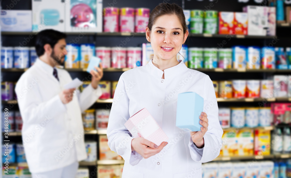 Woman pharmacist standing in drugstore